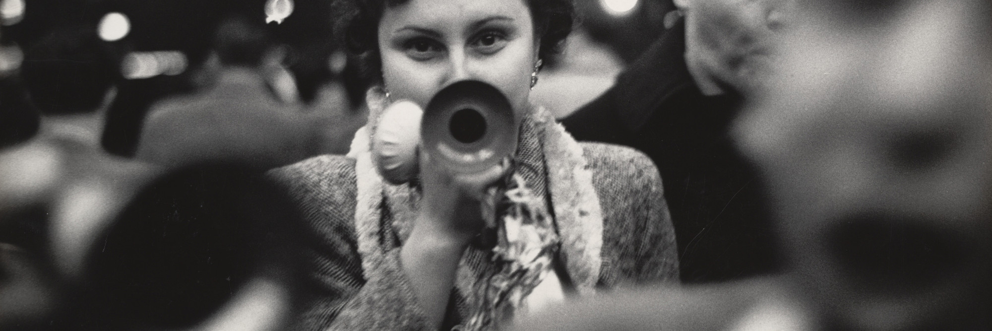 Dan Weiner. New Year’s Eve, Times Square. 1951. Gelatin silver print, 9 1/4 × 13 3/16″ (23.5 × 33.5 cm). The Museum of Modern Art. Gift of Sandra Weiner. © Dan Weiner