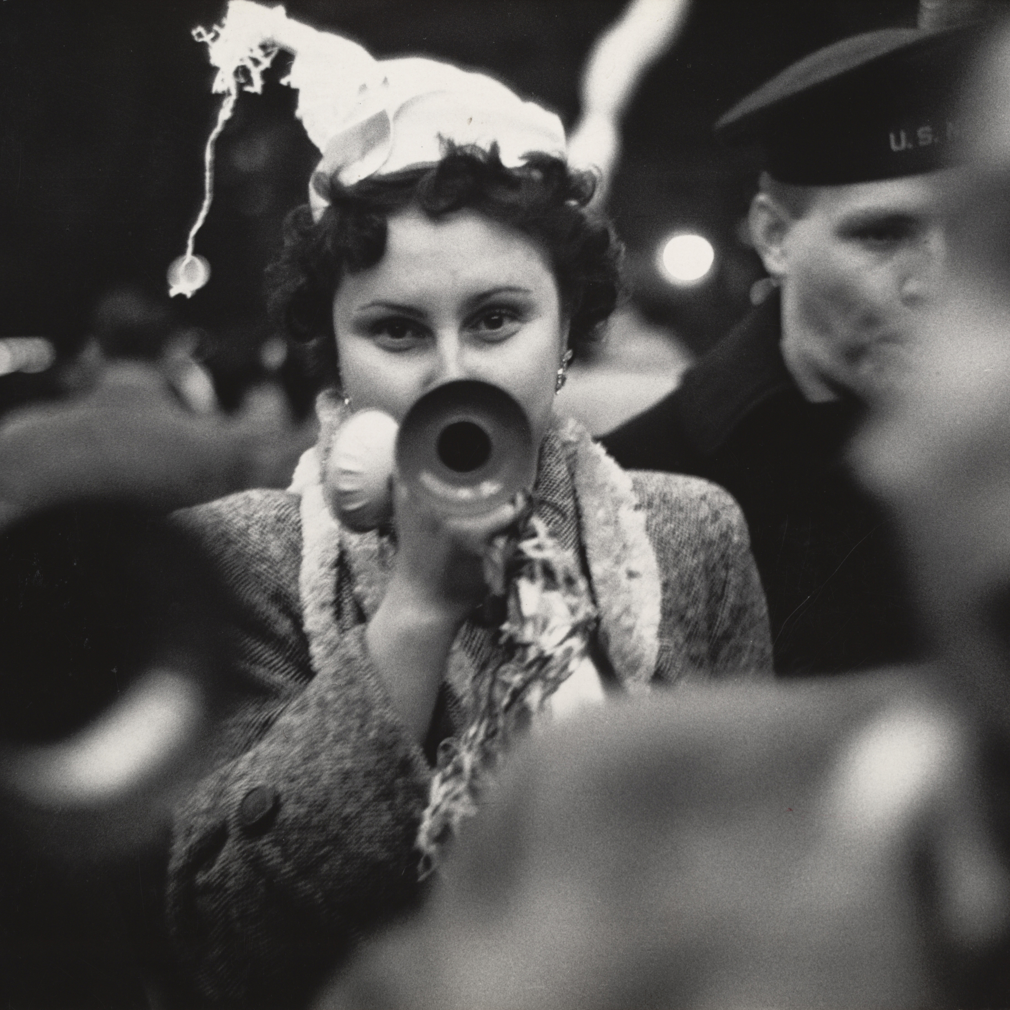 Dan Weiner. New Year’s Eve, Times Square. 1951. Gelatin silver print, 9 1/4 × 13 3/16″ (23.5 × 33.5 cm). The Museum of Modern Art. Gift of Sandra Weiner. © Dan Weiner