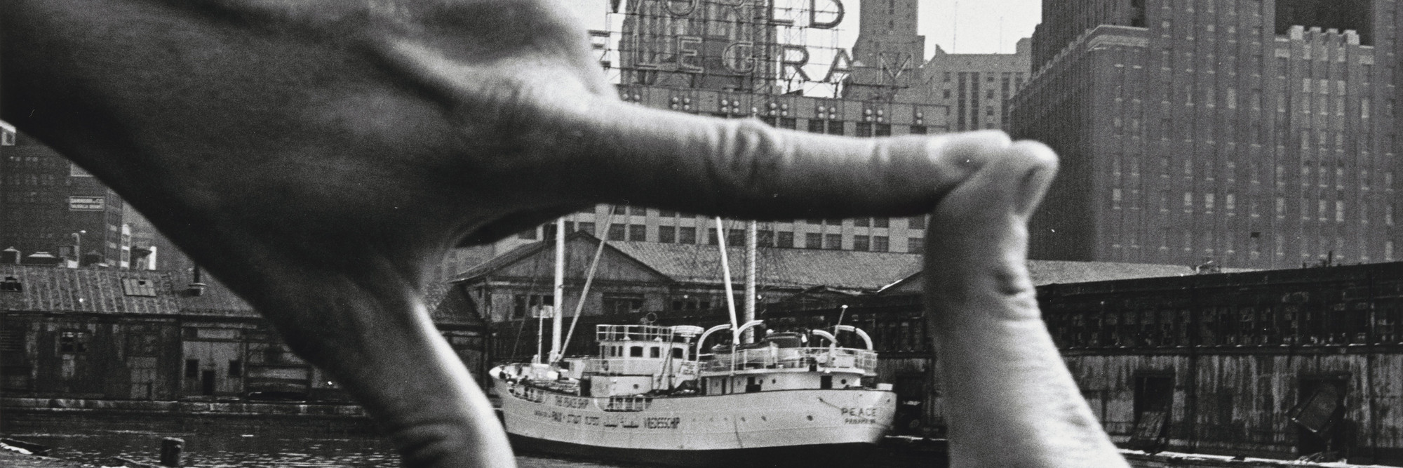 John Baldessari (American, b. 1931). Hands Framing New York Harbor from Pier 18. 1971. Photograph by Shunk-Kender (Harry Shunk [German, 1924–2006] and János Kender [Hungarian, 1937–2009]). Gelatin silver print, 7 3/8 × 9 15/16&#34; (18.8 × 25.2 cm). The Museum of Modern Art, New York. Gift of the Roy Lichtenstein Foundation in honor of Jennifer Winkworth and Kynaston McShine and in memory of Harry Shunk and János Kender. © 2015 John Baldessari. Photograph: Shunk-Kender © J. Paul Getty Trust. The Getty Research Institute, Los Angeles