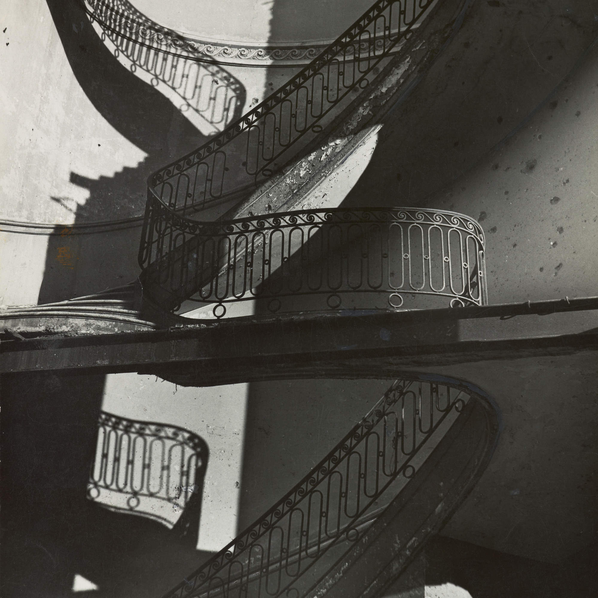 Bill Brandt. Bombed Regency Staircase, Upper Brook Street, Mayfair. c. 1942. Gelatin silver print, 9 x 7 5/8" (22.8 x 19.4 cm). Acquired through the generosity of Clarissa A. Bronfman