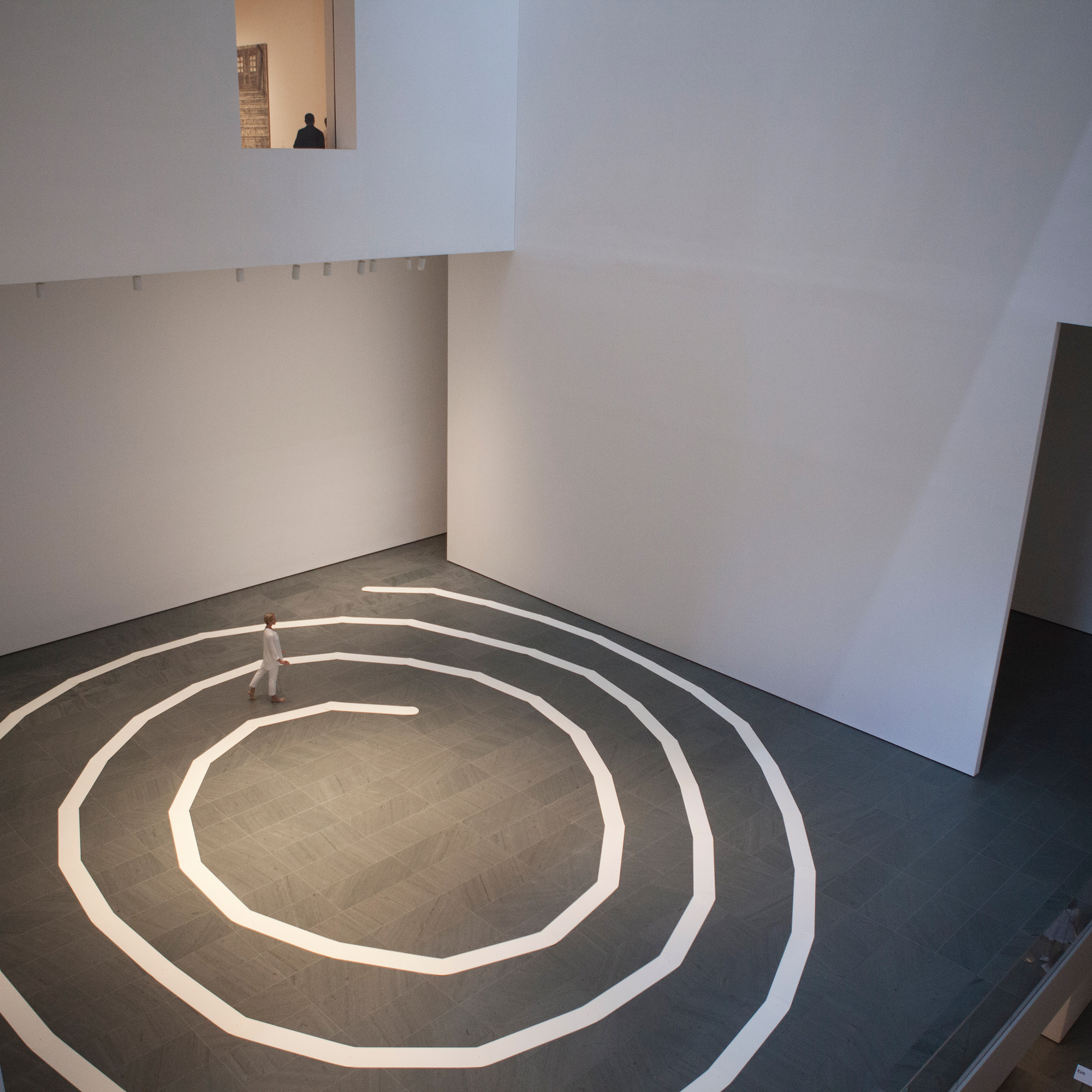 Performance of James Lee Byars’s The Mile-Long Paper Walk (1965–2014) at The Museum of Modern Art, August 17, 2014. Performed by Katie Dorn; choreographic construction by Lucinda Childs. © 2014 Museum of Modern Art, New York. Photo by Julieta Cervantes