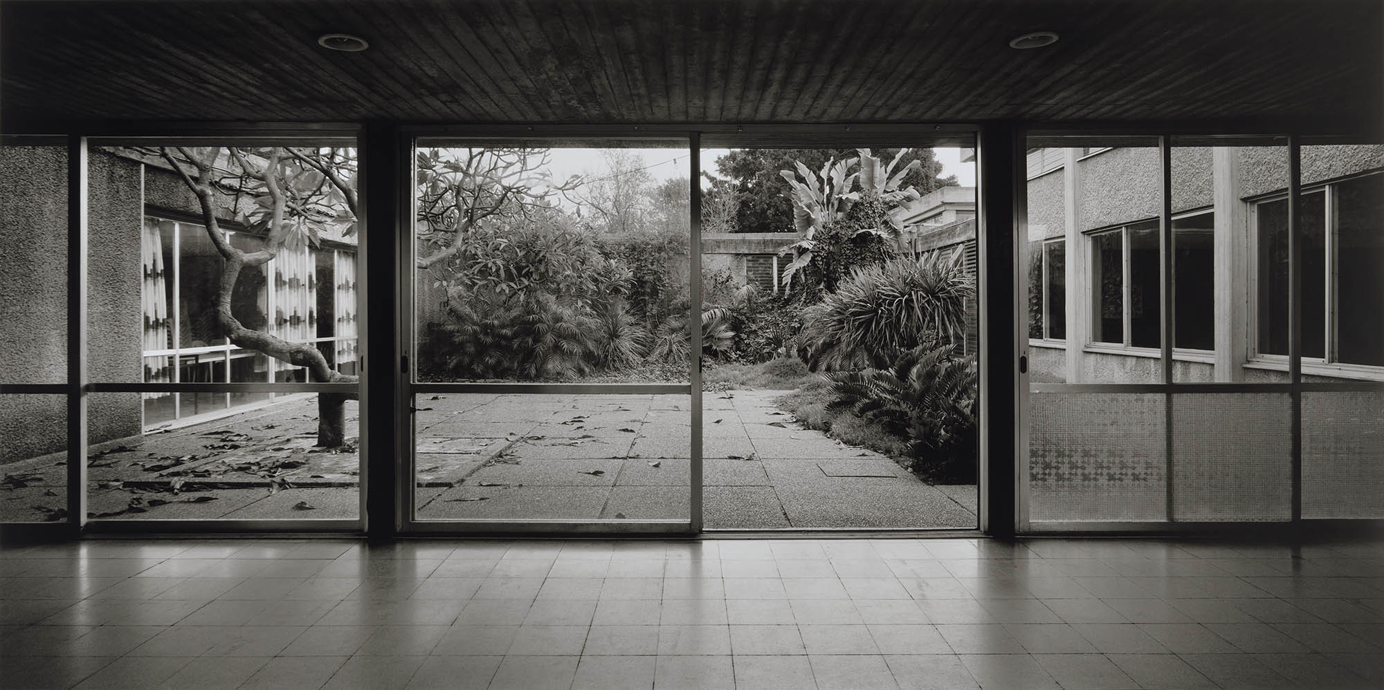 Gabriele Basilico. Kibbutz Kfar Masaryk, Israel. 1994. Courtyard of the dining hall designed by Munio Gitai Weinraub, 1962–63. Pigmented inkjet print, 31½ × 63″ (80 × 160 cm). The Museum of Modern Art, New York. Gift of Studio Gabriele Basilico