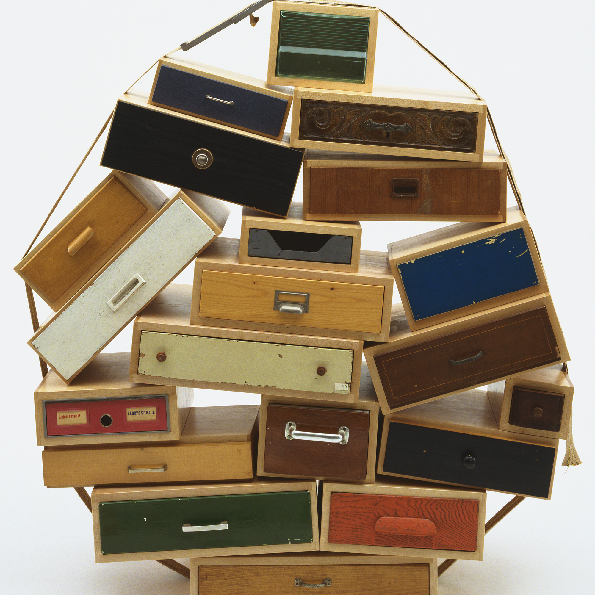 Tejo Remy. You Can’t Lay Down Your Memory Chest of Drawers. 1991. Metal, paper, plastic, burlap, contact paper and paint, 55.5 × 53 × 20″ (141 × 134.6 × 50.8 cm). Manufactured by Tejo Remy for Droog Design, the Netherlands. Frederieke Taylor Purchase Fund