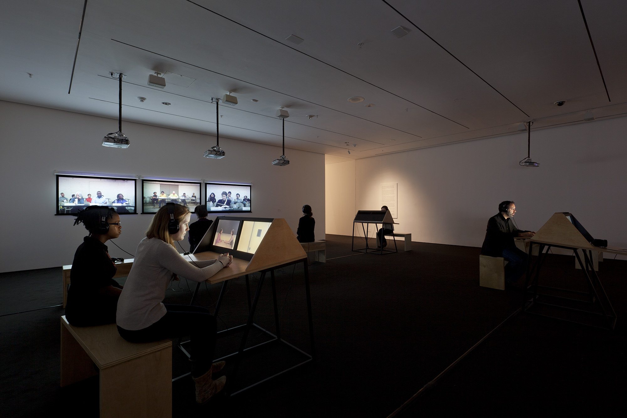 Andrea Geyer, Sharon Hayes, Ashley Hunt, Katya Sander, David Thorne. 9 Scripts from a Nation at War. 2007. Ten-channel video installation (color, sound). The Museum of Modern Art, New York. Committee on Media and Performance Art Funds. © 2012 the artists. Photograph by Jonathan Muzikar