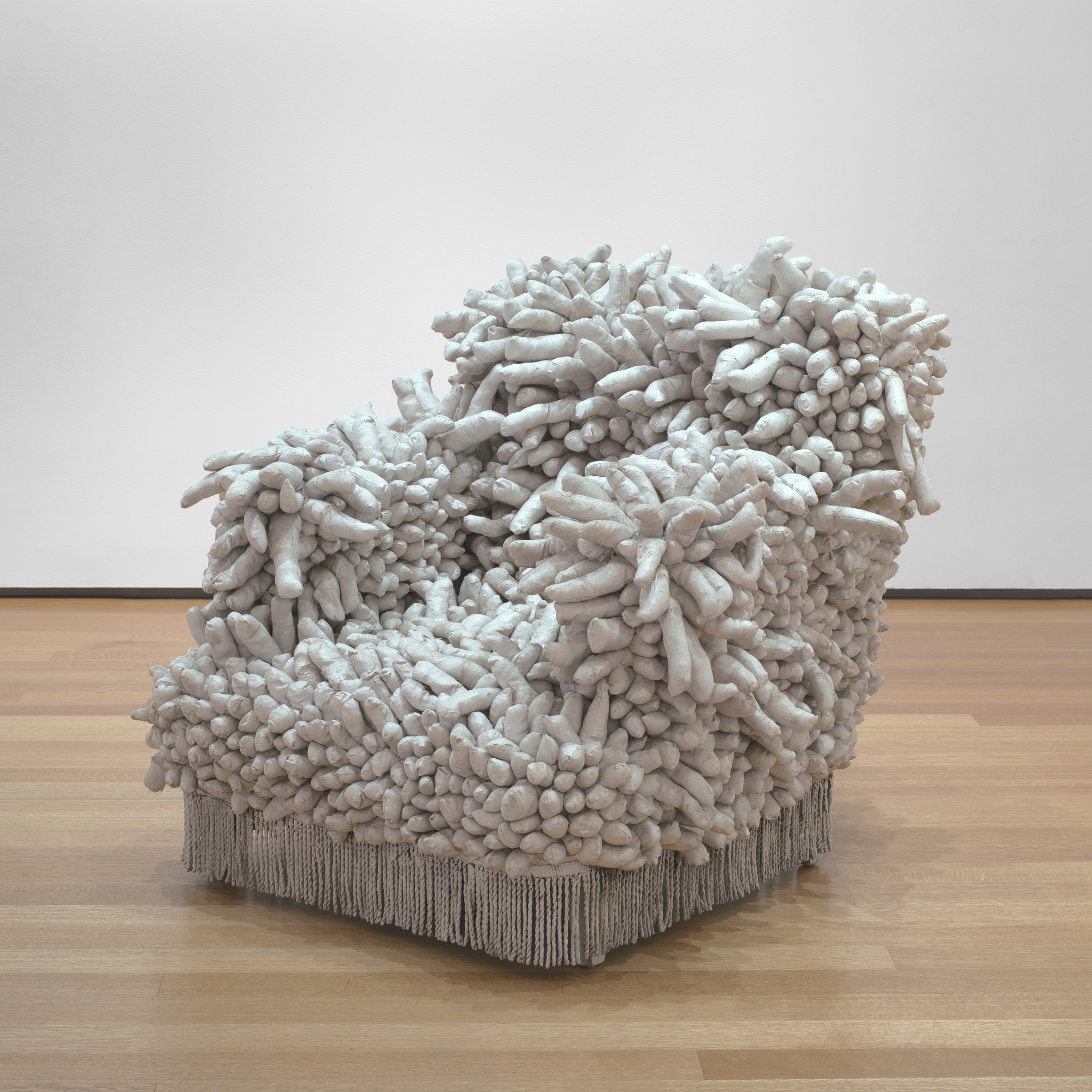 Yayoi Kusama (Japanese, born 1929). Accumulation No. 1. 1962. Sewn stuffed fabric, paint, and chair fringe, 37 x 39 x 43″ (94 x 99.1 x 109.2 cm). The Museum of Modern Art, New York. Purchase