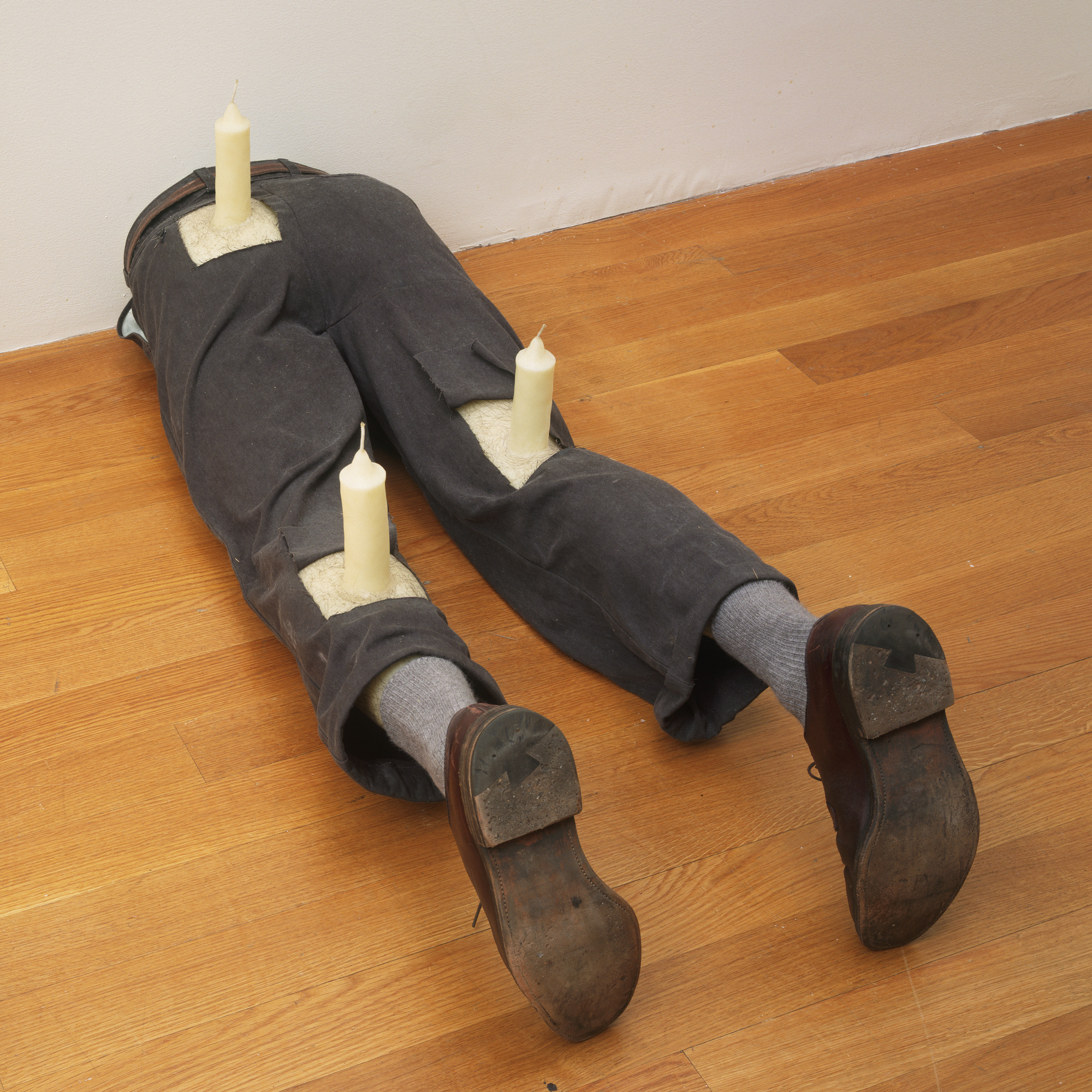 Robert Gober. Untitled. 1991. Wax, fabric, leather, human hair, and wood, 13 1/4 × 16 1/2 × 46 1/8″ (33.6 × 41.9 × 117.2 cm). Gift of Werner and Elaine Dannheisser. © 2003 Robert Gober