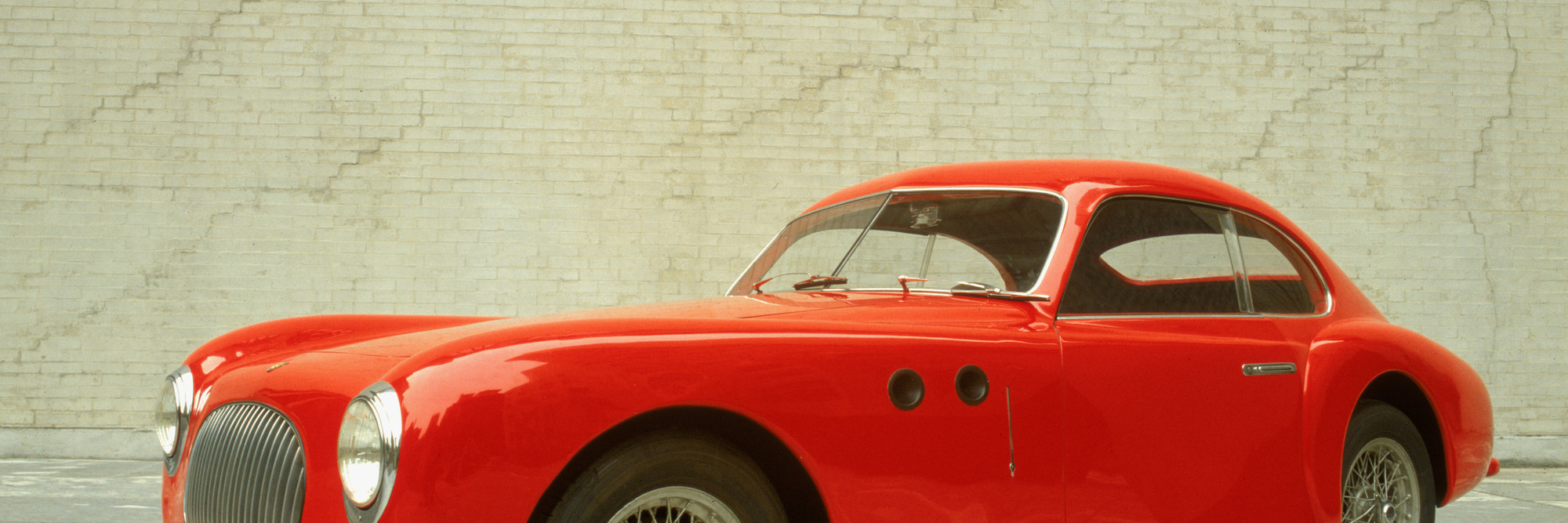 Pininfarina (Battista “Pinin” Farina). Cisitalia 202 GT. 1946. Aluminum body, 49″ × 13′ 2″ × 57 7/8″ (125 × 401 × 147 cm). The Museum of Modern Art, New York. Gift of the manufacturer