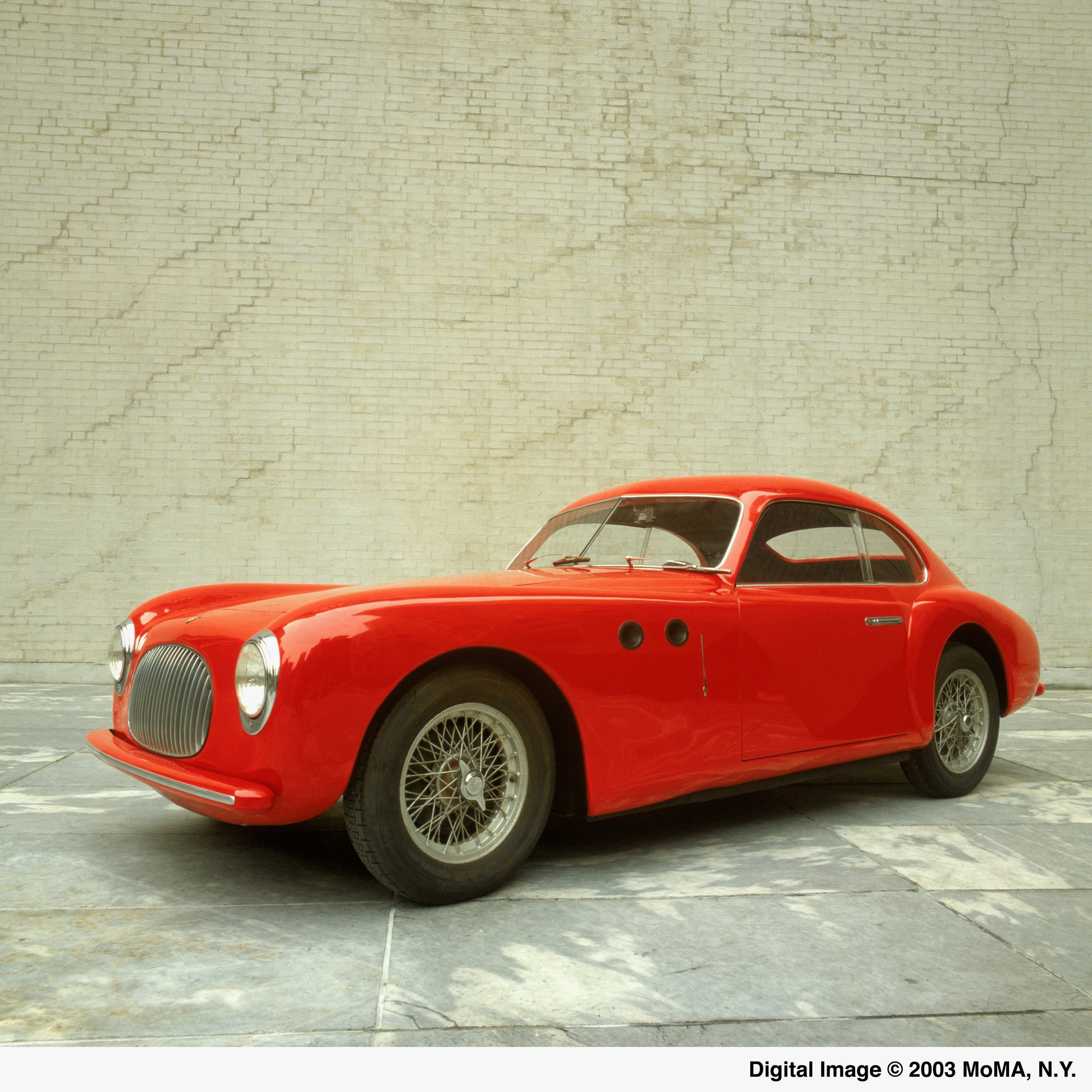 Pininfarina (Battista “Pinin” Farina). Cisitalia 202 GT. 1946. Aluminum body, 49″ × 13′ 2″ × 57 7/8″ (125 × 401 × 147 cm). The Museum of Modern Art, New York. Gift of the manufacturer