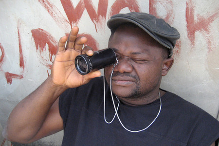 Nollywood Babylon. 2008. Canada/Nigeria. Written, directed, and photographed by Ben Addelman, Samir Mallal. Pictured: Lancelot prepares to take a shot. Photo: Samir Mallal. © 2008 National Film Board of Canada. All rights reserved