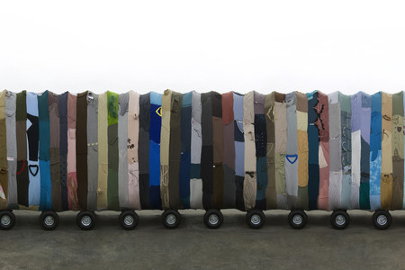 Yin Xiuzhen. Collective Subconscious. 2007. Minibus, stainless steel, used clothes, stools, music. Collection of the artist. © 2010 Yin Xiuzhen