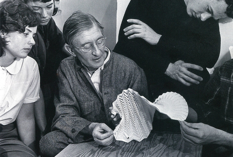 Josef Albers examining a folded paper construction with students at Black Mountain College, 1946. Photo: Genevieve Naylor