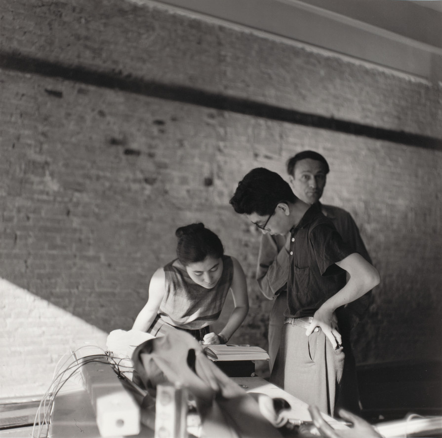 Yoko Ono, Toshi Ichiyanagi, and Jonas Mekas in gallery during Paintings & Drawings by Yoko Ono, AG Gallery, New York, July 17–30, 1961. Photo: George Maciunas