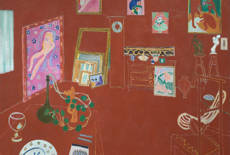 Henri Matisse. The Red Studio. Issy-les-Moulineaux, fall 1911. Oil on canvas. Mrs. Simon Guggenheim Fund. © 2021 Succession H. Matisse / Artists Rights Society (ARS), New York Alt Text: A painting of an artist studio, with every floor and wall surface washed with a brick red paint. Thin white lines delineate the floor from the wall. A grandfather clock, a 3-drawer dresser, sculptures displayed on stools, and colorful paintings lean against and hang on the wall in the top portion of the composition. In the bottom right corner is a lightly outlined high-backed chair facing into the room. On the bottom right side, a table juts out into the space with a painted blue plate, a set of blue pastels, an empty chalice, and a green leafy potted plant with its leaves wrapped around an abstract terracotta sculpture.