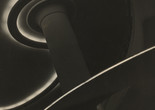 Image: Lucílio Corrêa Leite Filho. Fluorescent Symphony (Sinfonia fluorescente). c. 1960. Gelatin silver print. Acquired through the generosity of Estrellita Brodsky through the Latin American and Caribbean Fund Alt Text: A vertically-oriented black and white photograph with curvy white lines ebbing and flowing across the composition. Sections of architectural elements, like a column and curving walls, are obscured in shadow.