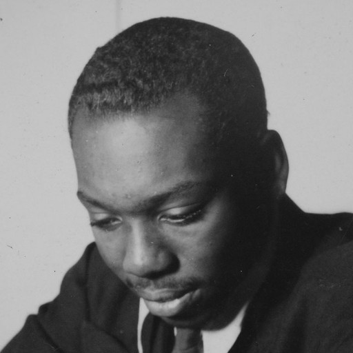 Jacob Lawrence with a panel from the Frederick Douglass series, c. 1939. Harmon Foundation Collection, National Archives and Records Administration, College Park, Md.