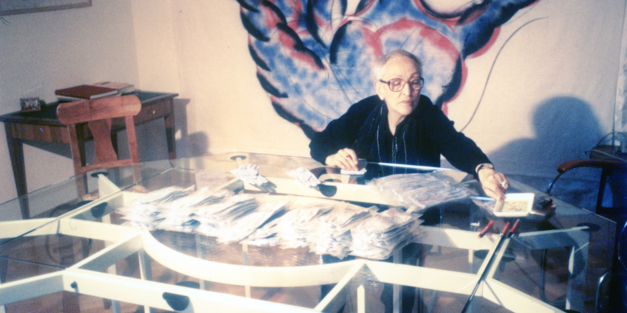 Meret Oppenheim signing 150 pairs of gloves in Zurich, 1985. Photo: Bice Curiger