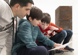 Photo: Martin Seck Image description: A family works on an activity together during a Family Gallery Talk.