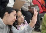 Photo: Martin Seck Image description: A family looks closely at art during a Family Gallery Talk.