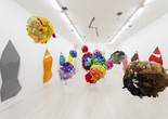 Mike Kelley. Deodorized Central Mass with Satellites. 1991/1999. Plush toys sewn over wood and wire frames with styrofoam packing material, nylon rope, pulleys, steel hardware and hanging plates, fiberglass, car paint, and disinfectant. overall dimensions variable. The Museum of Modern Art, New York. Partial gift of Peter M. Brant, courtesy the Brant Foundation, Inc. and gift of The Sidney and Harriet Janis Collection (by exchange), Mary Sisler Bequest (by exchange), Mr. and Mrs. Eli Wallach (by exchange), The Jill and Peter Kraus Endowed Fund for Contemporary Acquisitions, Anne and Joel Ehrenkranz, Mimi Haas, Ninah and Michael Lynne, and Maja Oeri and Hans Bodenmann