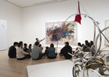 Families looking at a painting during a Family Gallery Talk. Photo: Martin Seck