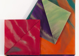 Dorothea Rockburne. Guardian Angel, II. 1982. Watercolor on vellum. The Museum of Modern Art, New York. Gift of R.L.B. Tobin. © 2024 Dorothea Rockburne/Artists Rights Society (ARS), New York Image description: A large geometric wall painting of overlapping triangles and squares, folded over one another along diagonal lines. The structural vellum shapes are painted with watery strokes of cream against deep red, dark violet bleeding into silver, and teal blooming with orange.