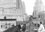Hans Namuth. _Untitled_ (Agnes Martin, Jack Youngerman, Ellsworth Kelly, Robert Indiana, and Delphine Seyrig on a rooftop in Coenties Slip). 1958. © 1991 Hans Namuth Estate. Courtesy Center for Creative Photography. From left to right: Delphine Seyrig, Robert Indiana, Duncan Youngerman, Ellsworth Kelly, Jack Youngerman, Agnes Martin.