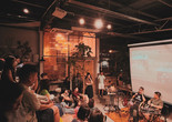 COEX@Kilang Besi, audience sitting atop chengal timber reclaimed from a different malay vernacular house