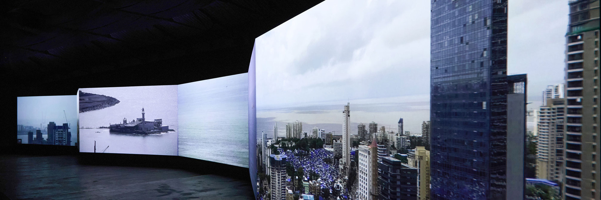 CAMP. Bombay Tilts Down. 2022. Loop, 6+1 screen environment from single-point CCTV video, 13 min. Installation view, Sassoon Docks, Mumbai, 2024. Image courtesy the artists
