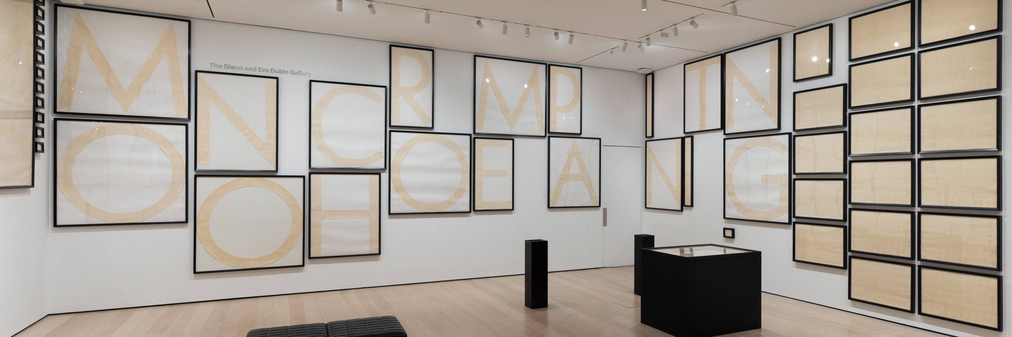 Installation view of Gallery 414: Stephen Prina, The Museum of Modern Art, New York, March 1, 2025–ongoing. Photo: Jonathan Dorado. Digital image © 2025 The Museum of Modern Art, New York. Shown: Stephen Prina. _Untitled/“The history of modern painting, to label it with a phrase, has been the struggle against the catalogue”_—Barnett Newman/(Monochrome Painting, 1988–1989). 1991. Ink wash on rag, barrier paper, and cardboard, 67 parts. The Museum of Modern Art, New York. Committee on Drawings Funds, 2014. © 2025 Stephen Prina