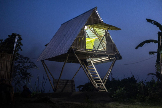 Photo of a Khudi Bari (tiny house) by Marina Tabassum Architects in Char Hijla, Chandpur, Lower Meghna River. 2021