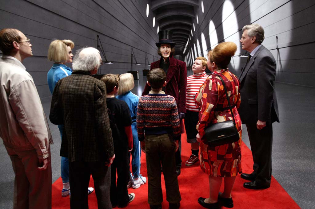 From left to right: Adam Godley, Missi Pyle, David Kelly, Jordan Fry, Annasophia Robb, Freddie Highmore, Johnny Depp, Philip Wiegratz, Franziska Troegner, and James Fox in Warner Bros. Pictures’ fantasy adventure <i>Charlie and the Chocolate Factory</i>. USA. 2005. Directed by Tim Burton. Photo by Peter Mountain. From left to right: Adam Godley, Missi Pyle, David Kelly, Jordan Fry, Annasophia Robb, Freddie Highmore, Johnny Depp, Philip Wiegratz, Franziska Troegner, and James Fox in Warner Bros. Pictures’ fantasy adventure <i>Charlie and the Chocolate Factory</i>. USA. 2005. Directed by Tim Burton. Photo by Peter Mountain.