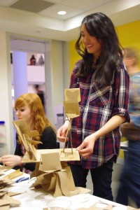 A teen creates a sculpture based on Baranoff-Rossine's work as part of In the Making