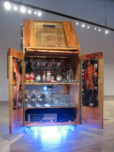 Cameron Platter.ATM/ Minibar/ Soundsystem. 2008. Carved avocado wood, mixed media, found objects. © 2011 Cameron Platter