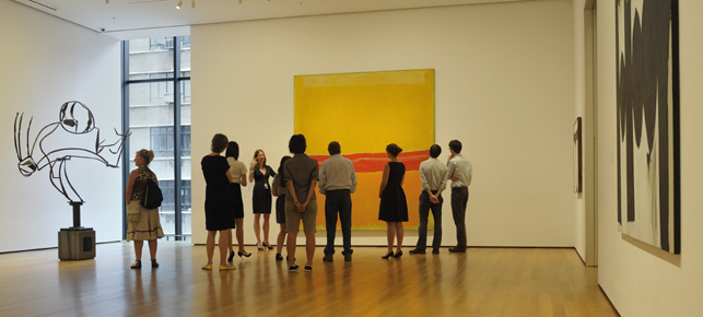 Visitors enjoy a tour of MoMA's galleries. Photo: Martin Seck. Shown, from left: David Smith. Australia. 1951. Painted steel on cinder block base. The Museum of Modern Art. Gift of William Rubin. Mark Rothko. No. 5/No. 22. 1950 (dated on reverse 1949). Oil on canvas. The Museum of Modern Art. Gift of the artist. © 1998 Kate Rothko Prizel & Christopher Rothko/Artists Rights Society (ARS), New York