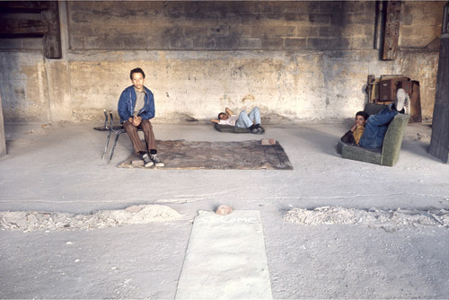 Kids occupying Tina Girouard’s installation “Swept House”. The children helped provide furnishings for “House” by scavenging through dump heaps around the bridge. Photograph by Tina Girourad. The Brooklyn Bridge Event, N.Y., N.Y. (May 24, 1971). Color slide. MoMA PS1, 2464. The Museum of Modern Art Archives, New York.