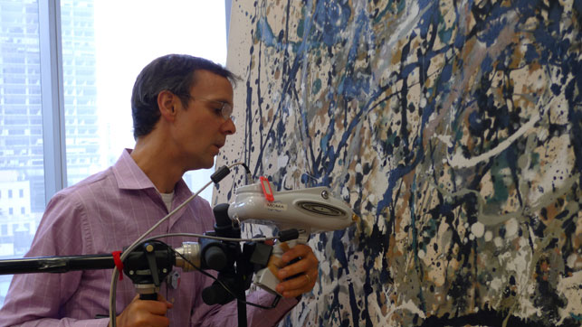 Conservation scientist Chris McGlinchey conducts elemental analysis using a handheld X-ray Fluorescence (XRF) analyzer