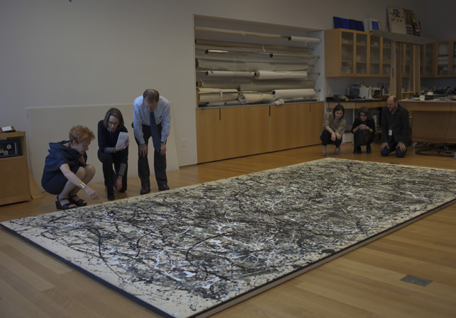 A meeting between conservators and curators to view <em>One: Number 31, 1950</em>