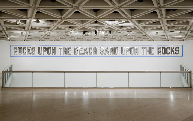 Lawrence Weiner (American, born 1942). Rocks Upon the Beach Sand Upon the Rocks, 1988. Language + the materials referred to, dimensions variable. Acquisition from the Werner Dannheisser Testamentary Trust. © 2013 Lawrence Weiner / Artists Rights Society (ARS), New York. Installation view, the Art Gallery of Western Australia, 2013