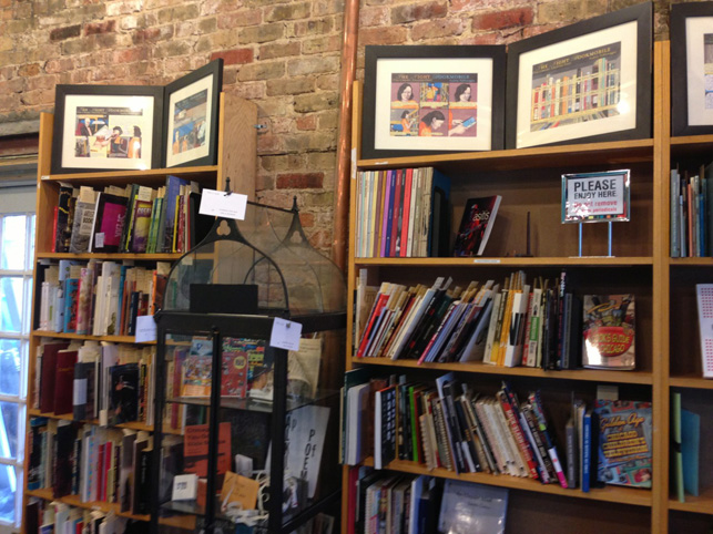 At the Read/Write Library, stacks and a vitrine featuring a volunteer-curated selection of materials from the collection.