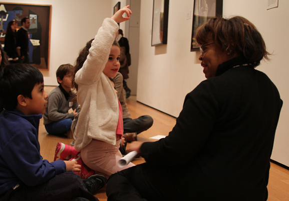 Looking at Surrealist paintings in the Museum's galleries. Photo: Johnny Tan
