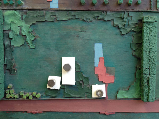 Setting down lifting paper elements; rare earth magnets on the front and back of the model “clamp” them in place