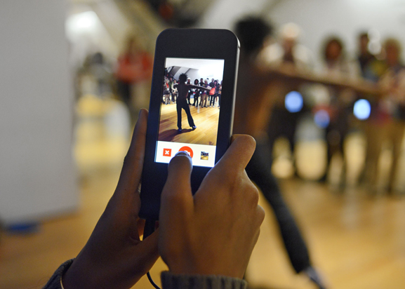 A visitor in the galelries using the MoMA Audio+ device. Photo: Martin Seck