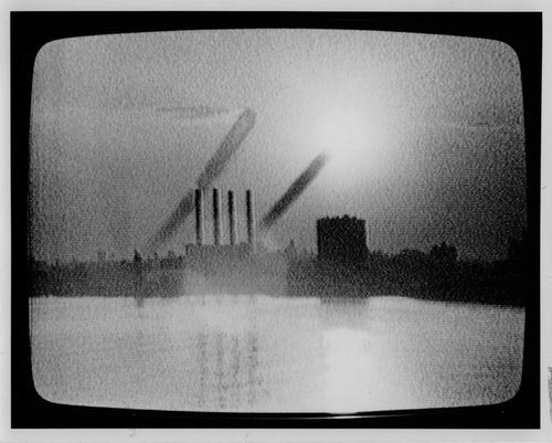 Mary Lucier. <i>Dawn Burn</i> (detail). 1975. Seven monitors of increasing sizes from 15 to 25 inches diagonal; slide projector mounted on wall; seven-channel video converted from ½-inch, open-reel tape to DigiBeta and DVD (black and white, silent); one color slide (34:00 min., continuous). Structure: 7’3”–8’ 2” x 20’ (approx.) x 20”–27”. Collection San Francisco Museum of Modern Art.Accessions Committee Fund: gift of Doris and Donald Fisher, Marion E. Greene, Evelyn and Walter Haas, Jr., and Leanne B. Roberts, 1991. © 2011 Mary Lucier