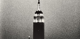 Andy Warhol. <i>Empire</i>. 1964. 16mm film, black and white, silent, approx. 8 hours, 5 minutes. The Museum of Modern Art. Original film elements the gift of The Andy Warhol Foundation for the Visual Arts, restored by the Department of Film and Media, The Museum of Modern Art. &copy; 2006 The Andy Warhol Museum, Pittsburgh