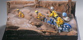 Dieter Roth. <i>Motorradrennfahrer III (Motorcycle racers III)</i>. 1970/1994 (reconstruction). Toy, chocolate, and painting and cooking utensils on wood, 13 x 18 1/8 x 7 1/8" (33 x 46 x 18 cm). Dieter Roth Foundation, Hamburg. Photo: Heini Schneebli, Hamburg
