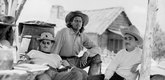 William Wellman, Joel McRea, and editor James B. Clark on the set of <i>Buffalo Bill.</i> 1944. USA. Directed by William A. Wellman. &copy; Twentieth Century Fox