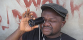 Nollywood Babylon. 2008. Canada/Nigeria. Written, directed, and photographed by Ben Addelman, Samir Mallal. Pictured: Lancelot prepares to take a shot. Photo credit: Samir Mallal. &copy; 2008 National Film Board of Canada. All rights reserved