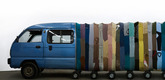 Yin Xiuzhen. <i>Collective Subconscious</i>. 2007. Minibus, stainless steel, used clothes, stools, music. Collection of the artist. © 2010 Yin Xiuzhen.