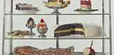 Pastry Case, I
Date: 1961-62
Medium: Burlap and muslin soaked in plaster, painted with enamel, metal bowls, and ceramic plates in glass-and-metal case
Dimensions: 20 3/4 x 30 1/8 x 14 3/4" (52.7 x 76.5 x 37.3 cm)
Credit Line: The Sidney and Harriet Janis Collection
MoMA Number: 639.1967.a-dd
