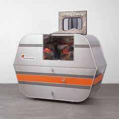 Andrea Zittel, A-Z Escape Vehicle: Customized by Andrea Zittel, 1996. Exterior: steel, insulation, wood and glass. Interior: colored lights, water, fiberglass, wood, papier-mâché, pebbles and paint, 62" x 7' x 40" (157.5 x 213.3 x 101.6 cm). The Norman and Rosita Winston Foundation, Inc. Fund and an anonymous fund. © 2012 Andrea Zittel. 